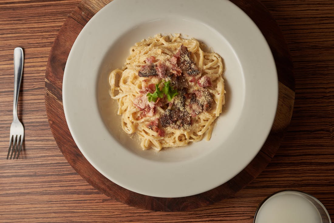 Hand-rolled spaghetti carbonara with pancetta and grana padano — Italian dining in Preston, VIC
