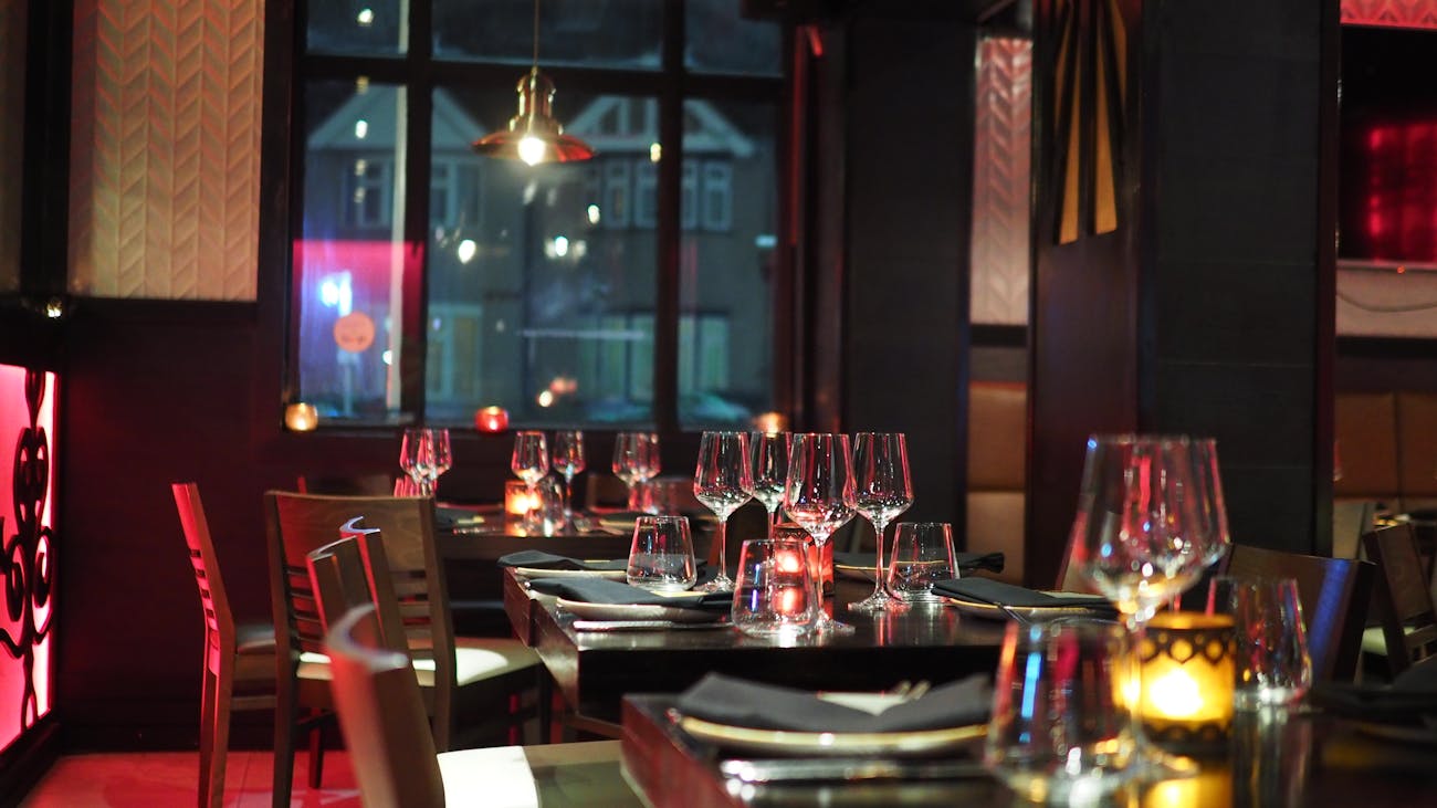 Candlelit long table set for a private function at The Warehouse Pizzeria — events venue Preston VIC